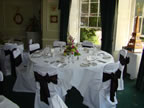 White Chair Covers and Chocolate Taffeta Sash